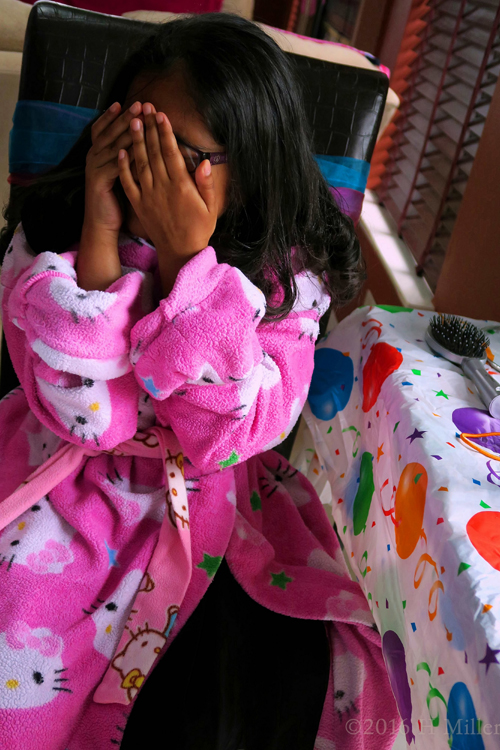 Covering Her Face While Hairspray Is Used.