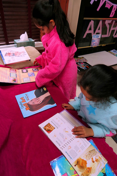 Engrossed In The Nail Art Books, The Birthday Spa Guests Get Some Ideas.