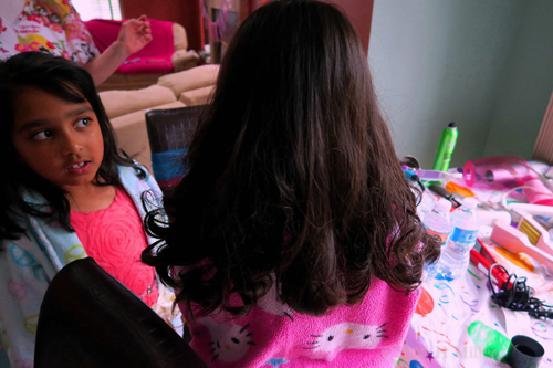 The Birthday Girl Poses As Her Friend Checks Out Her New Hairstyle.