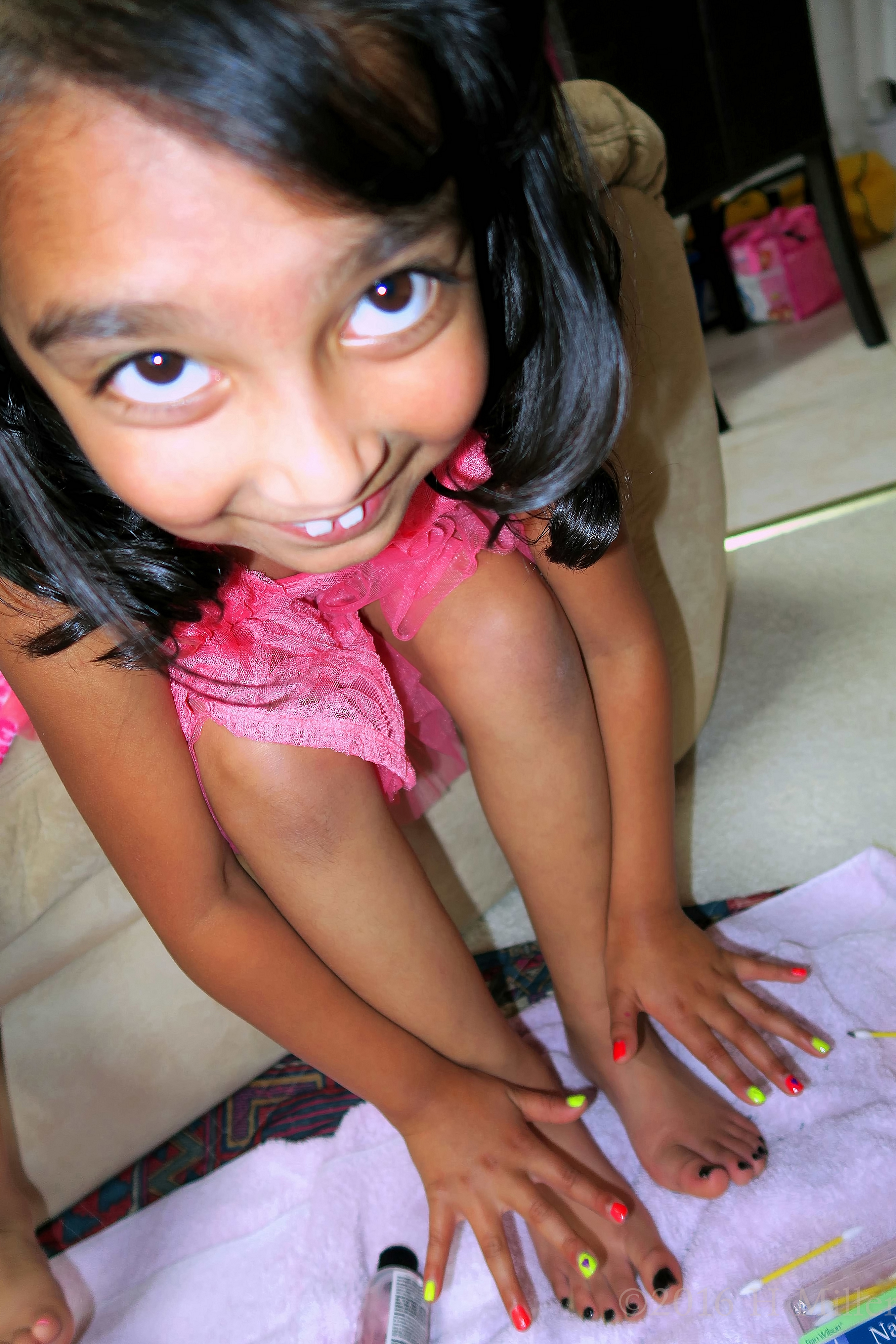 Smiling With Her Mani And Pedi. 