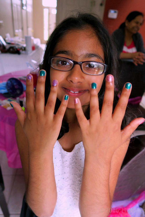 Metallic Green Polish Alternating With Clear Purple Glitter.