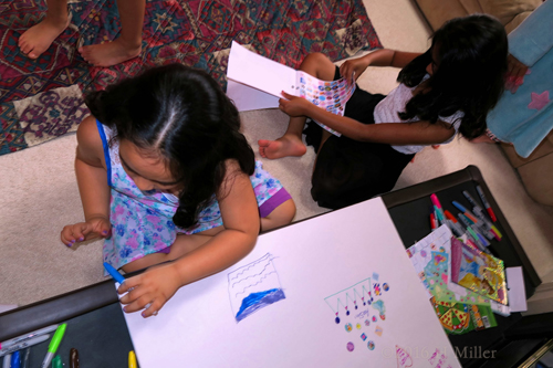 The Girls Focused On Their Activity. The Girls Focused On Their Activity.