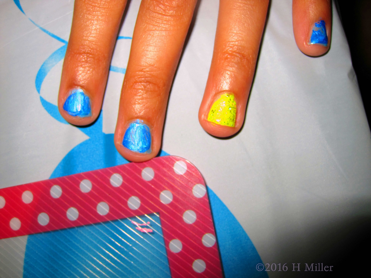 Pretty Blue Girls Manicure With Yellow Accent Nail. 