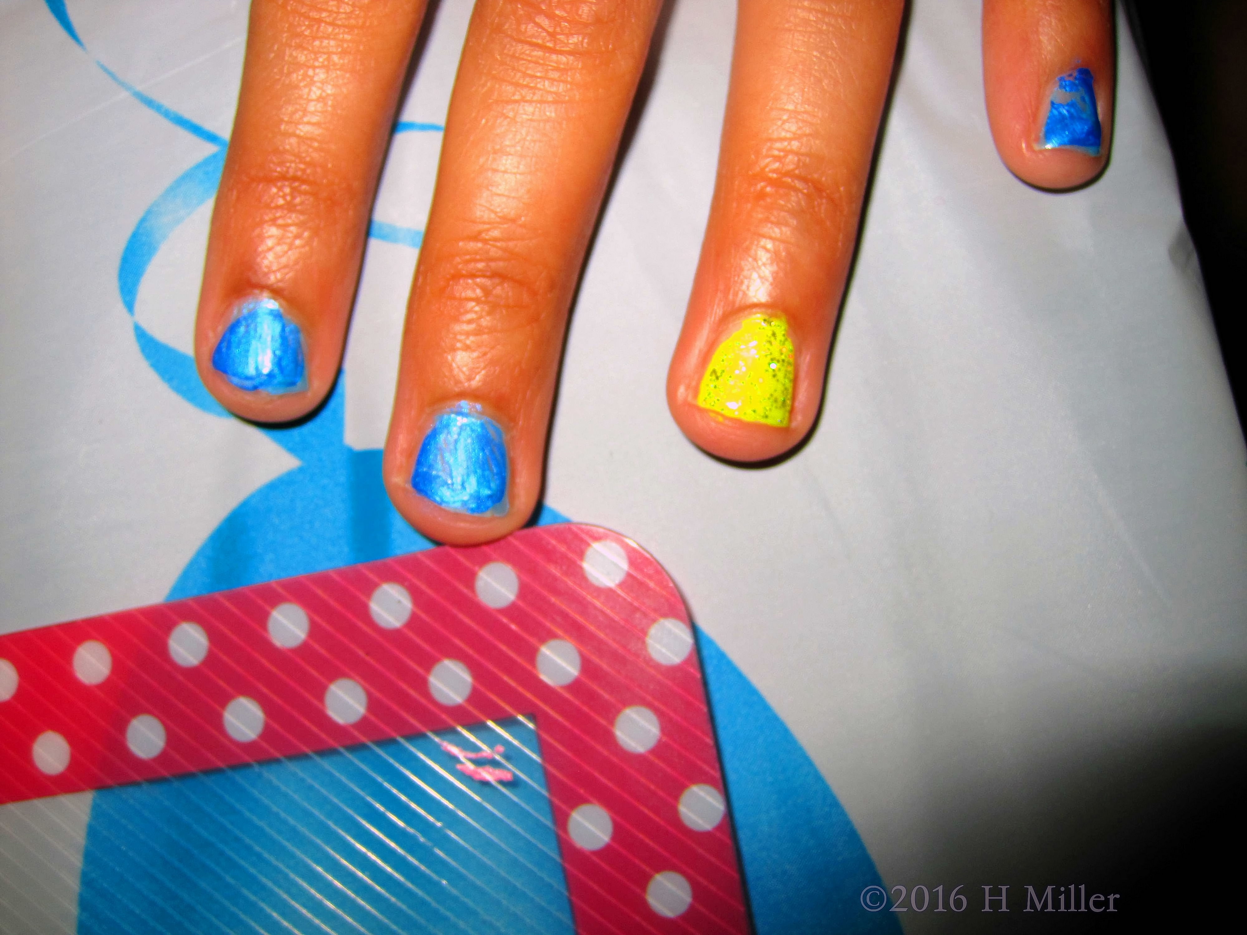 Pretty Blue Girls Manicure With Yellow Accent Nail. Pretty Blue Girls Manicure With Yellow Accent Nail.