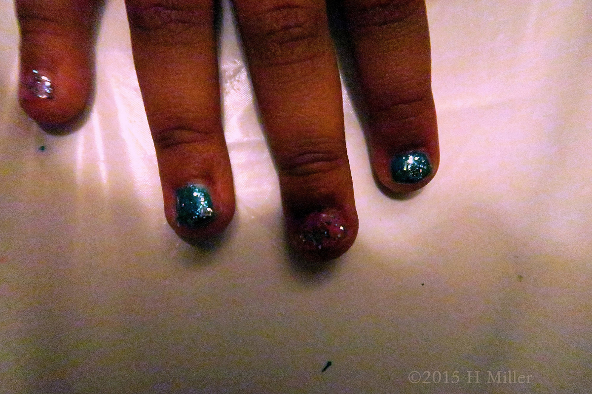 The Blue Glitter Is Extra Glittery On Her Manicure! 