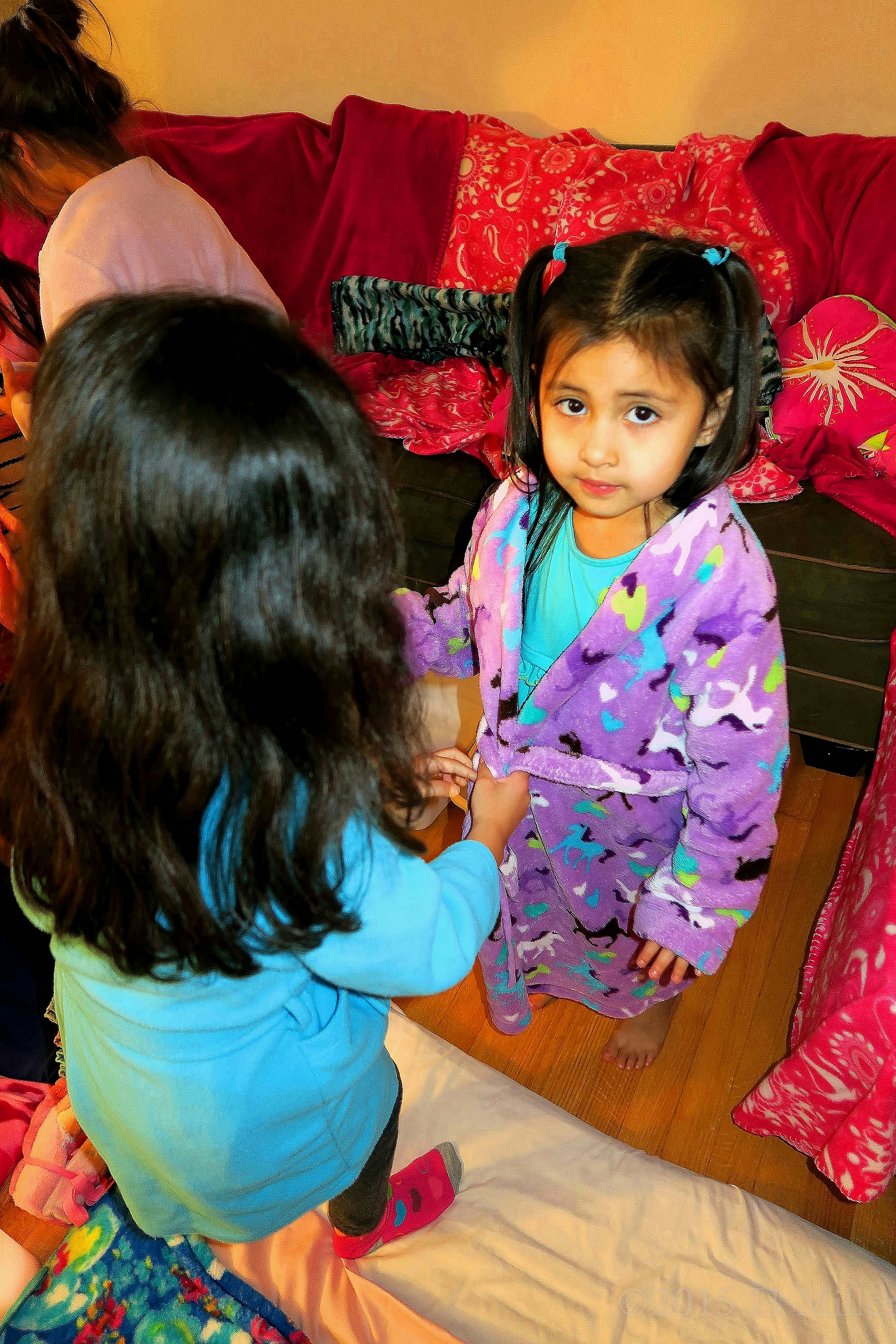 Another Girl Helping To Tie A Sash So Her Robe Is Secure. What A Nice Friend Another Girl Helping To Tie A Sash So Her Robe Is Secure. What A Nice Friend