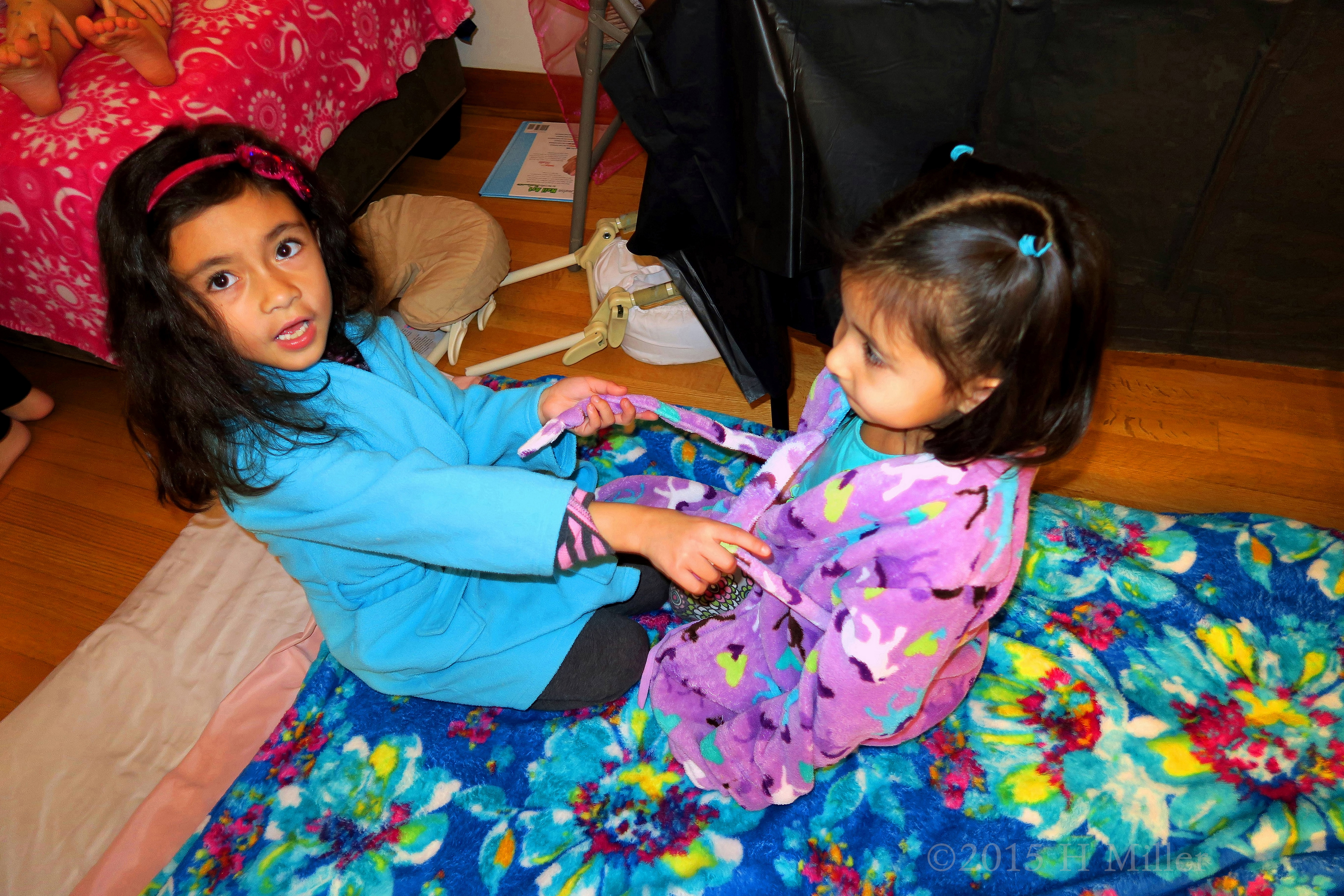 Tying Her Little Friend's Sash Again! Tying Her Little Friend's Sash Again!