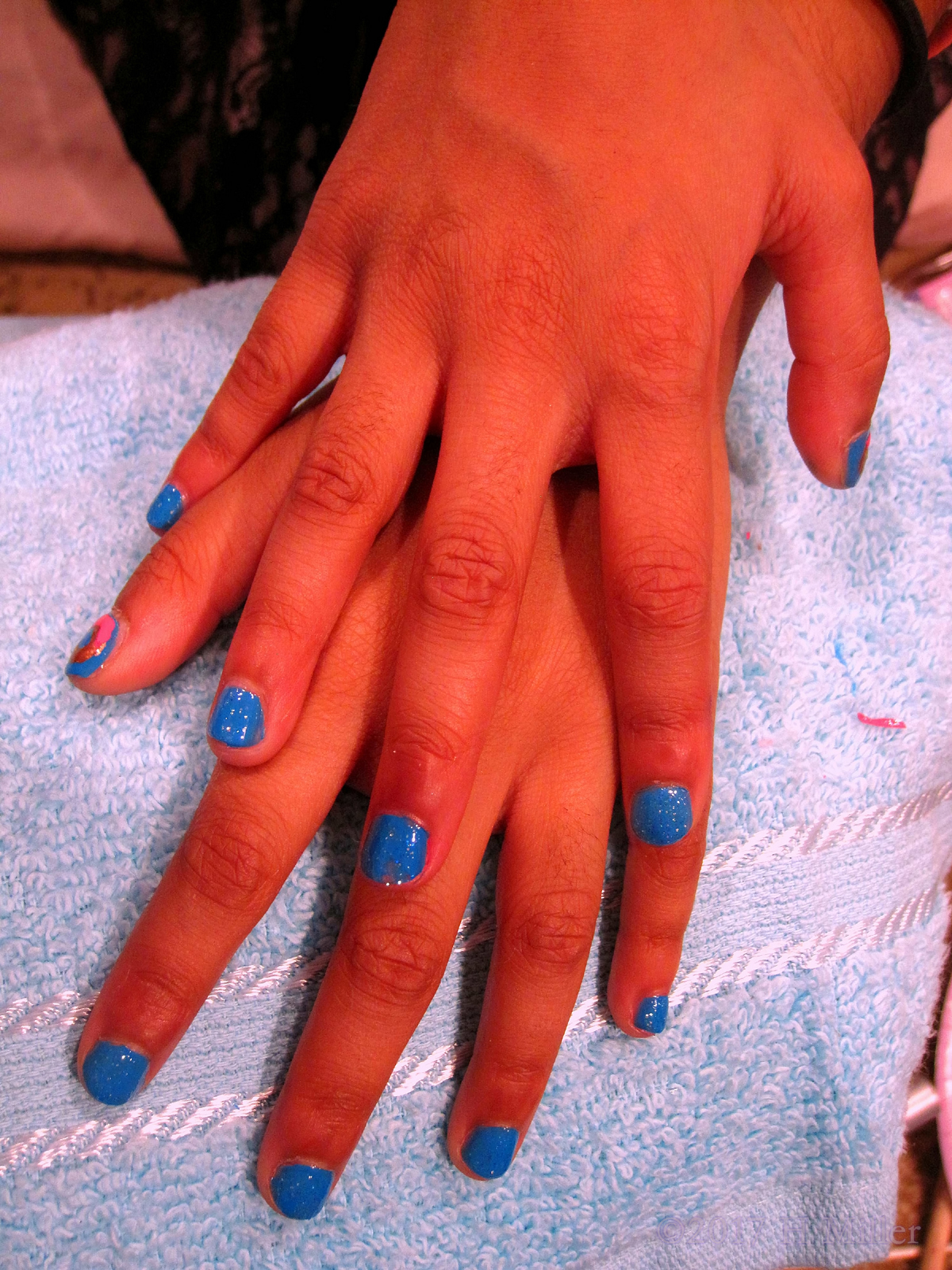 Closeup Of A Beautiful Blue Kids Manicure. 