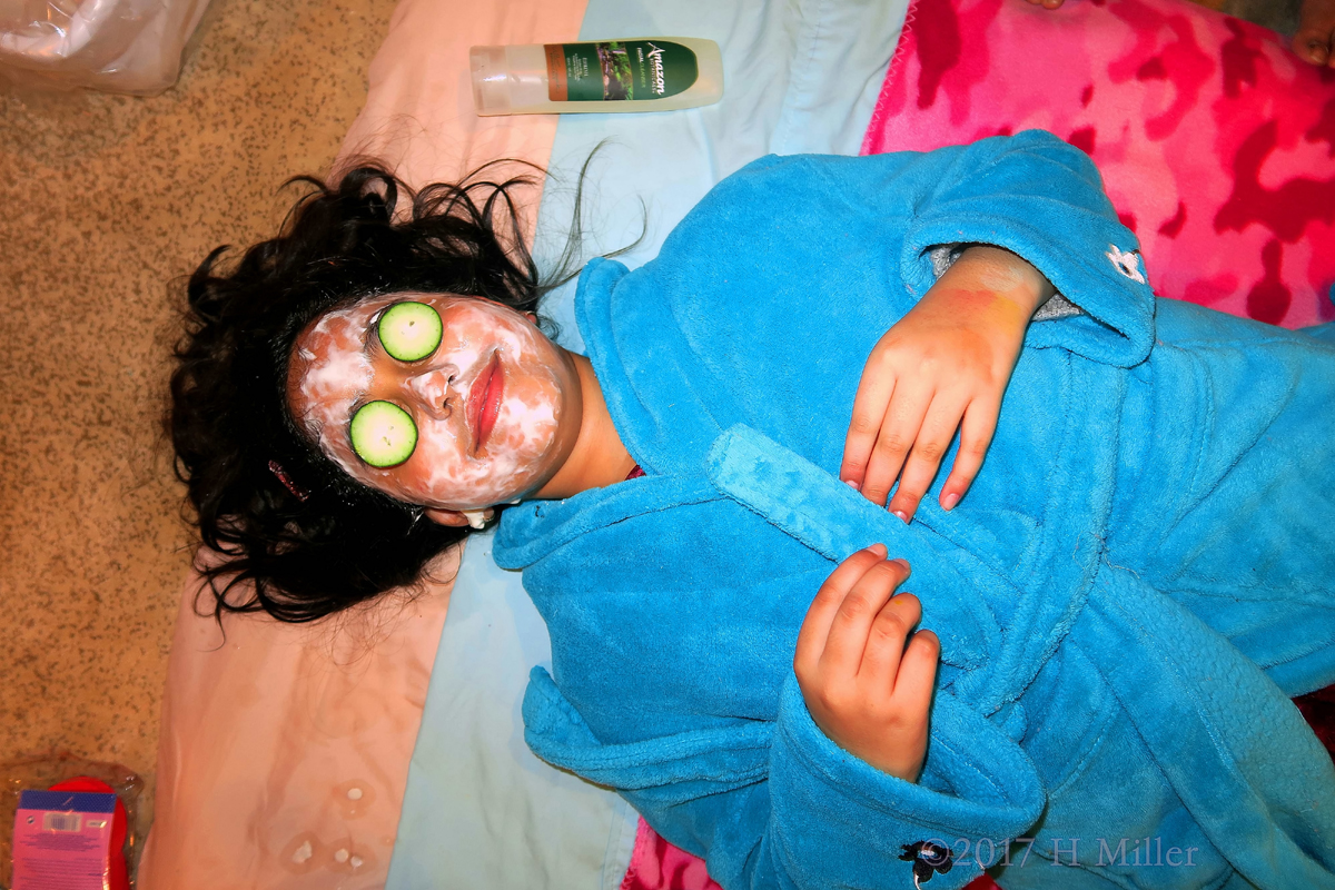 Relaxing With Cukes On Her Eyes During The Kids Facial. 