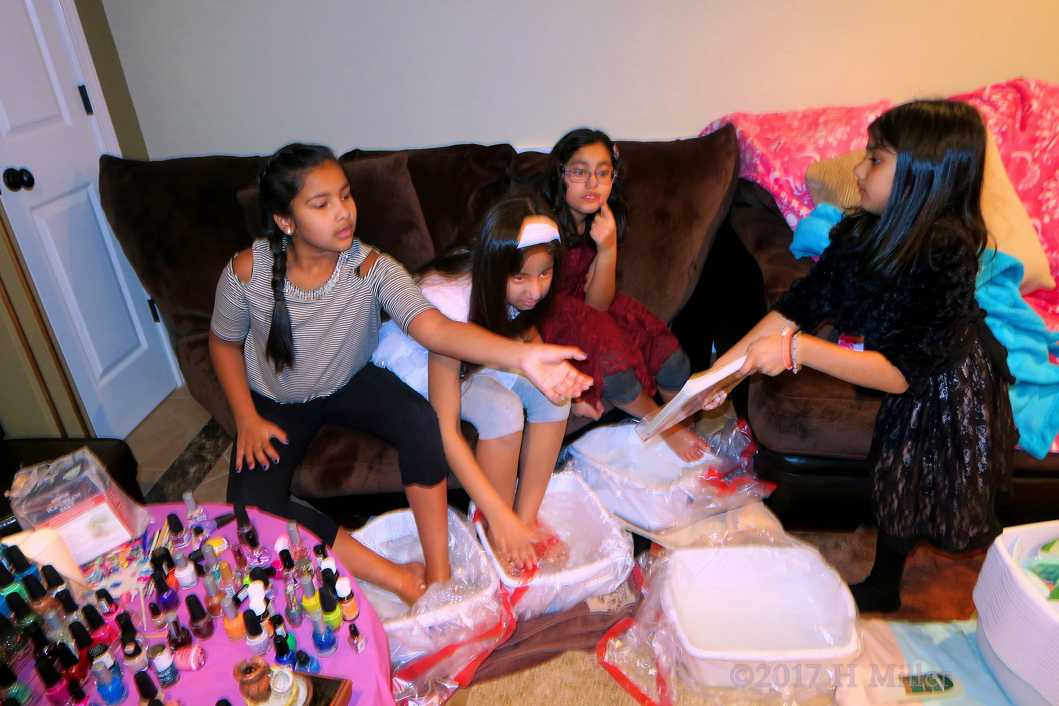 Looking At Books Together During The Girls Spa Pedicures. Looking At Books Together During The Girls Spa Pedicures.