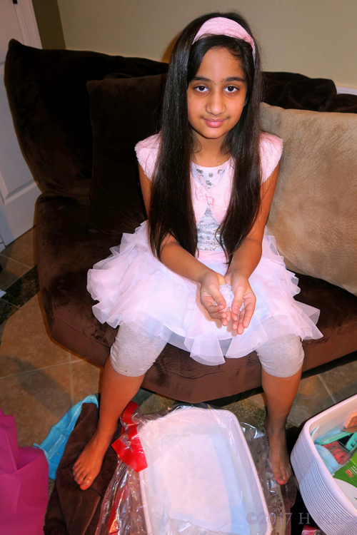 Holding The Halite Salt Before The Kids Pedicure Footbath. Holding The Halite Salt Before The Kids Pedicure Footbath.