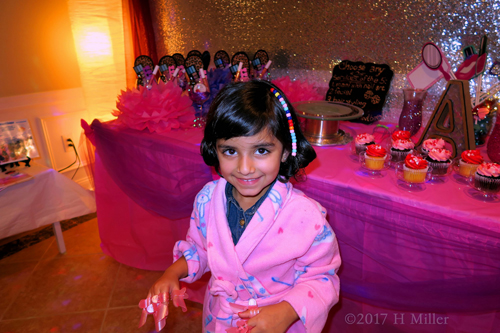 Smiling With Her Manicure Protectors After Mini Manis And Hair Beading. Smiling With Her Manicure Protectors After Mini Manis And Hair Beading.