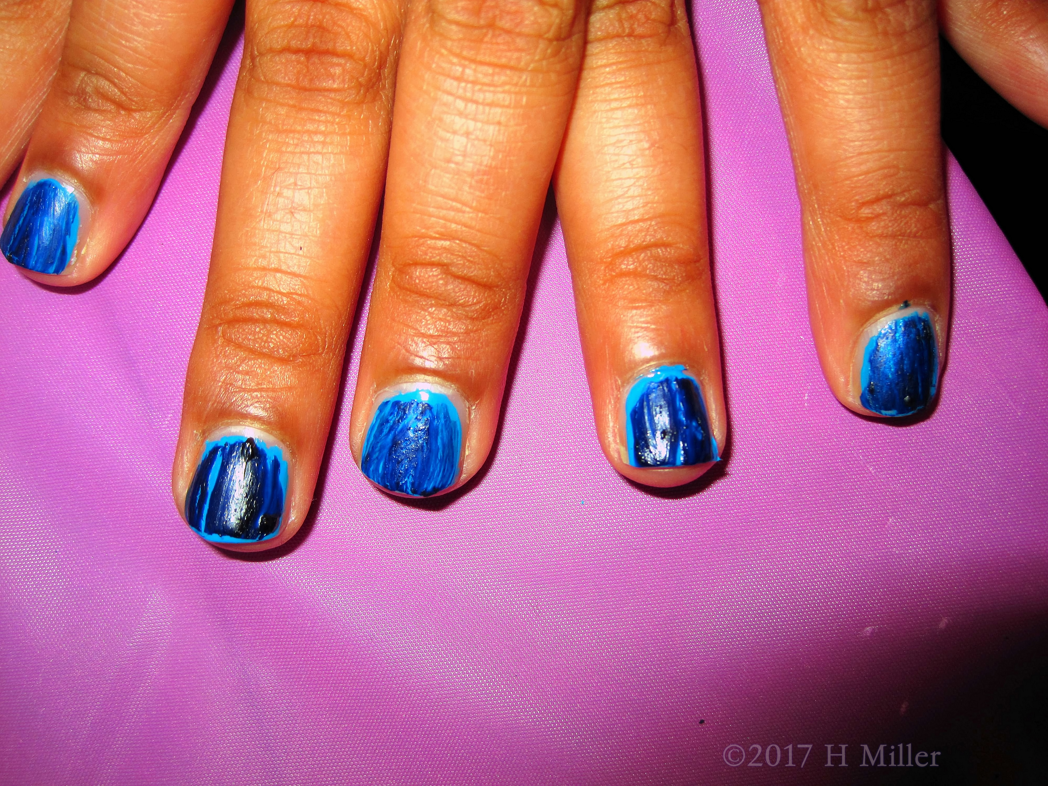 Closeup Of The Awesome Girls Spa Mini Mani With Shatter Polish Black Over Blue.