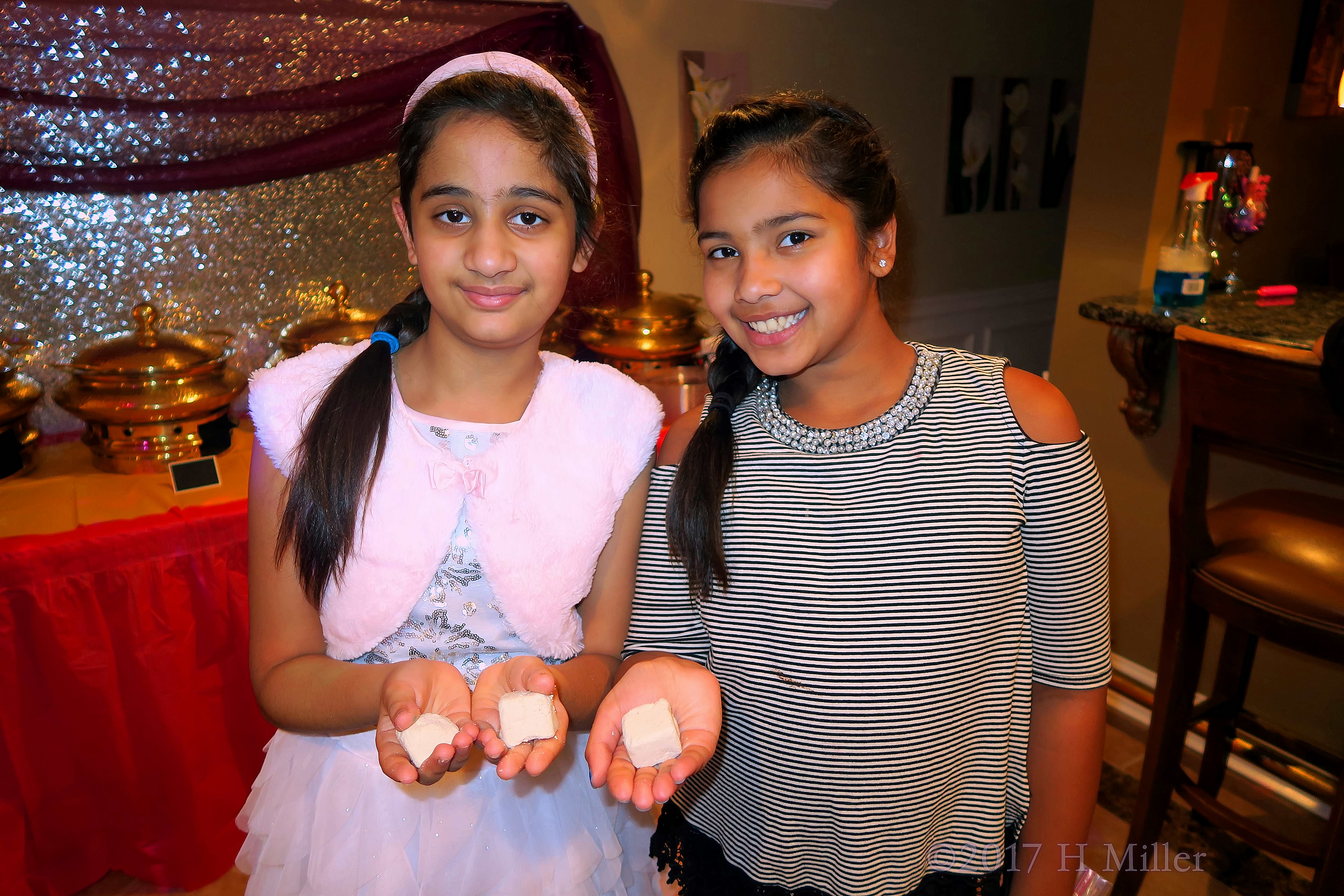 Smiling And Showing The Fizzy Bath Bombs. Smiling And Showing The Fizzy Bath Bombs.