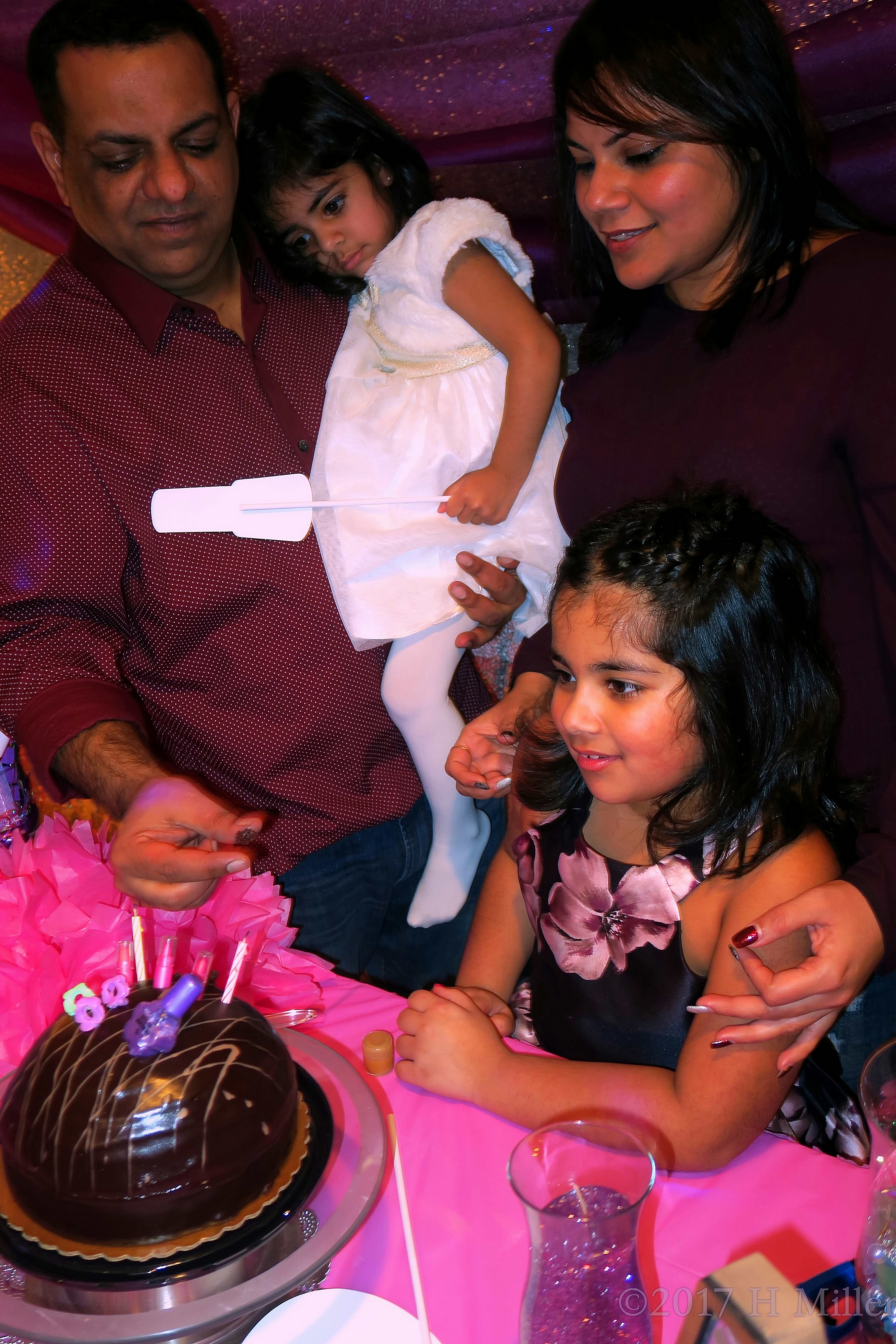 The Birthday Girl's Dad Ready To Feed Her Chocolate. The Birthday Girl's Dad Ready To Feed Her Chocolate.