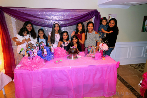 Group Photo At The Cake Table.