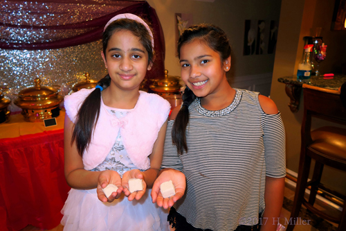Smiling And Showing The Fizzy Bath Bombs. Smiling And Showing The Fizzy Bath Bombs.