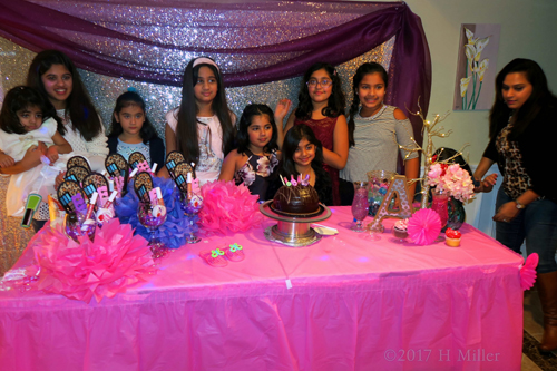 Smiling For Another Group Picture Around The Spa Cake. Smiling For Another Group Picture Around The Spa Cake.