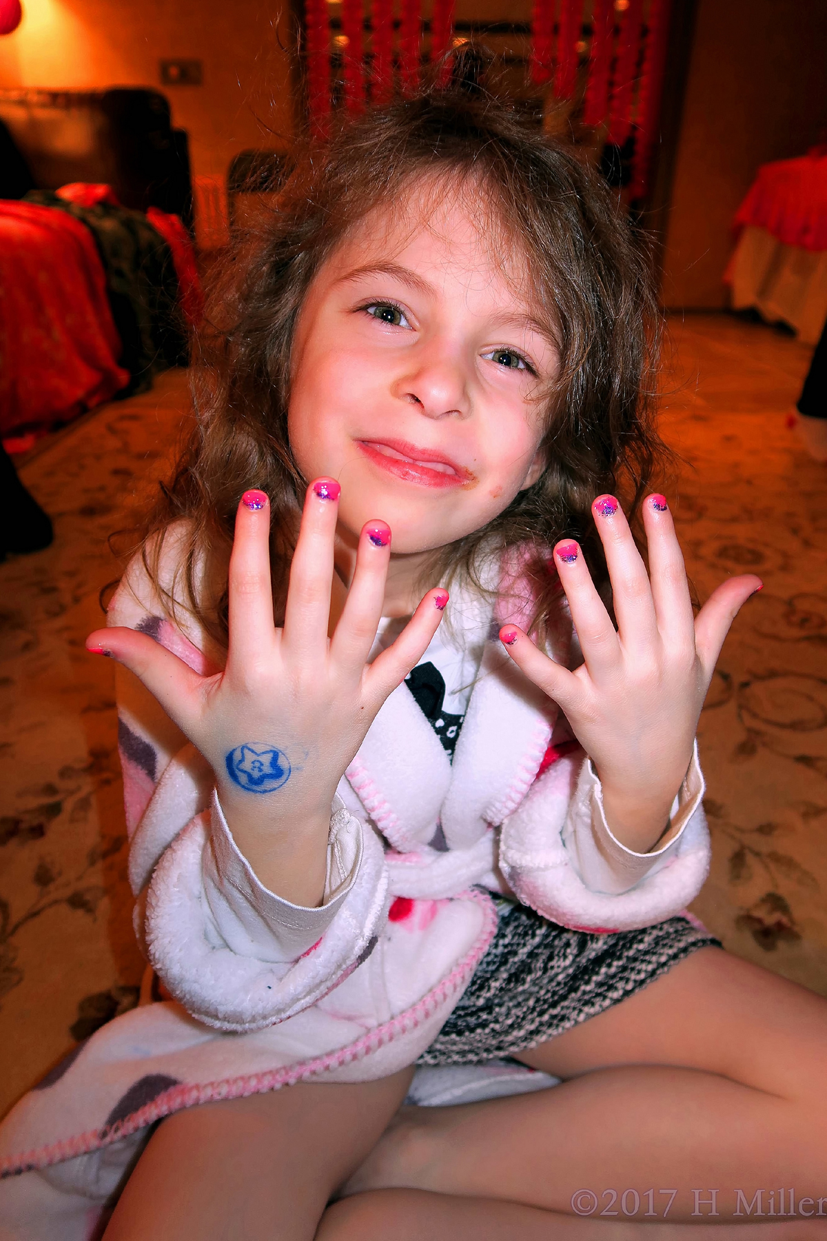 Cmiling With Her New Kids Manicure. 