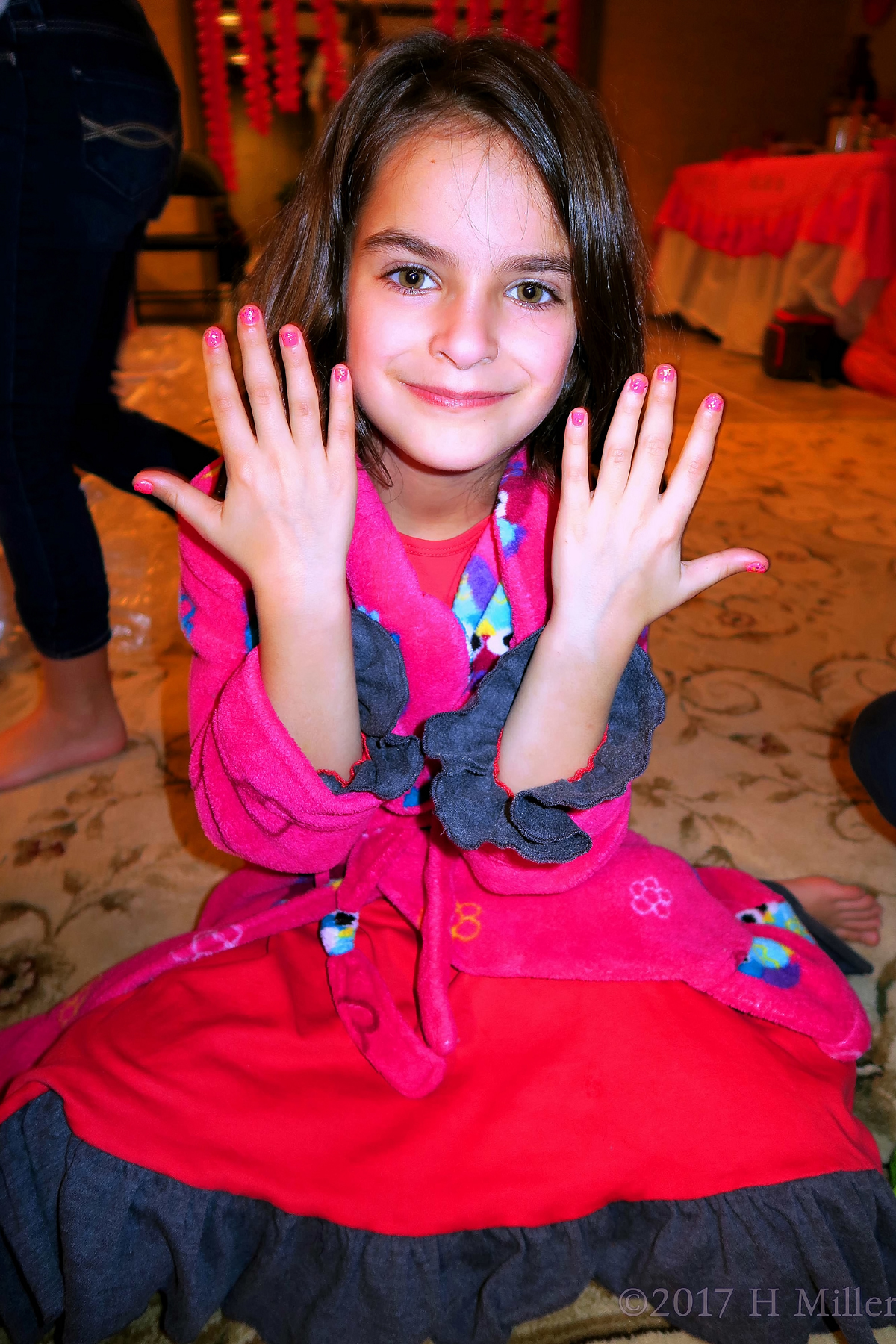 Smiling With Her Pink And Glitter Kids Manicure. 