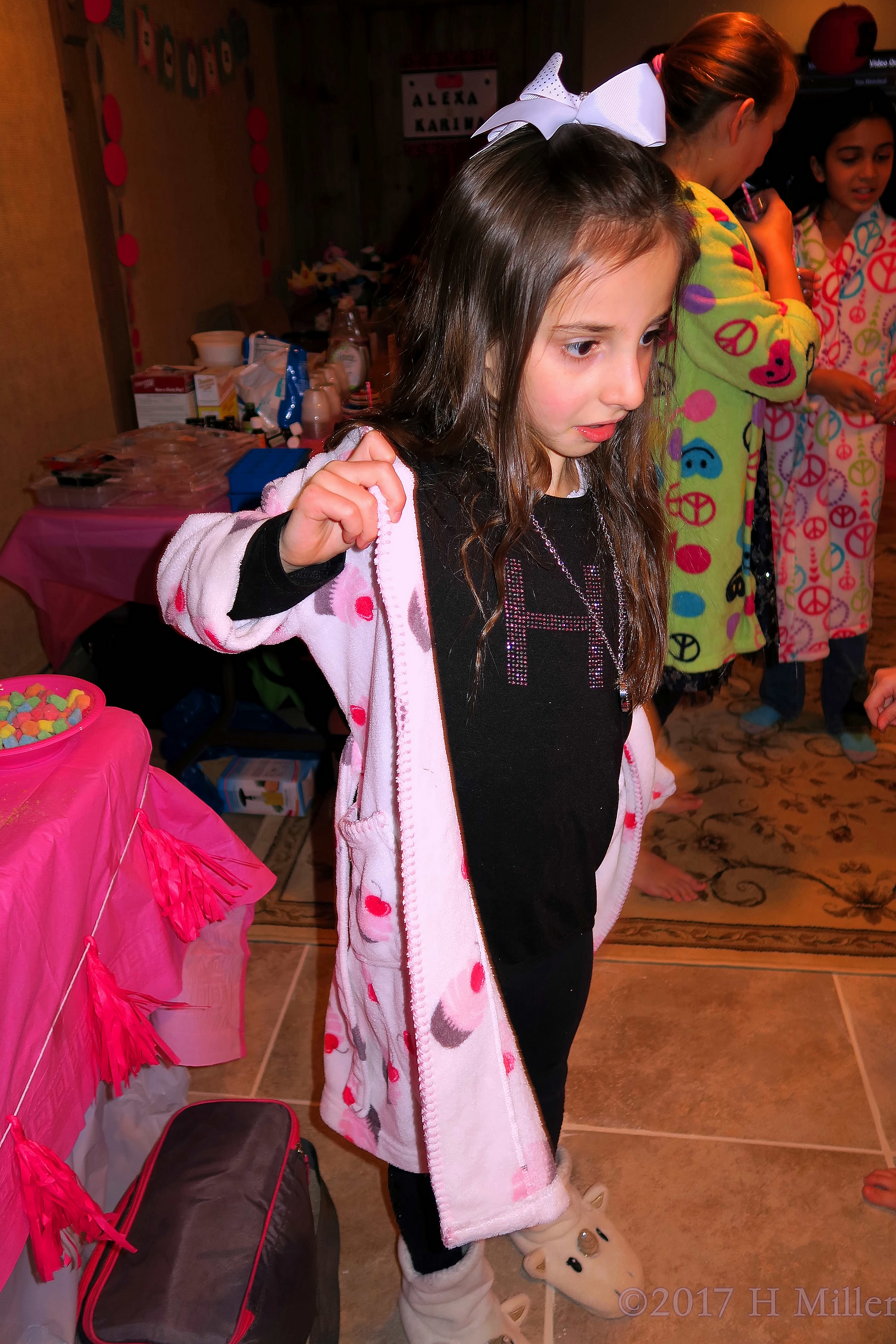 Trying On Her Kids Spa Robe. Trying On Her Kids Spa Robe.