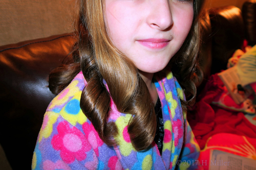 Close Up Of The Curled Girls Hairstyle. Close Up Of The Curled Girls Hairstyle.