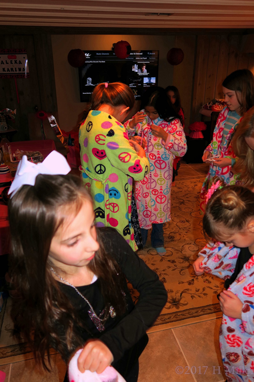 Helping Each Other Tie Their Spa Robe Sashes