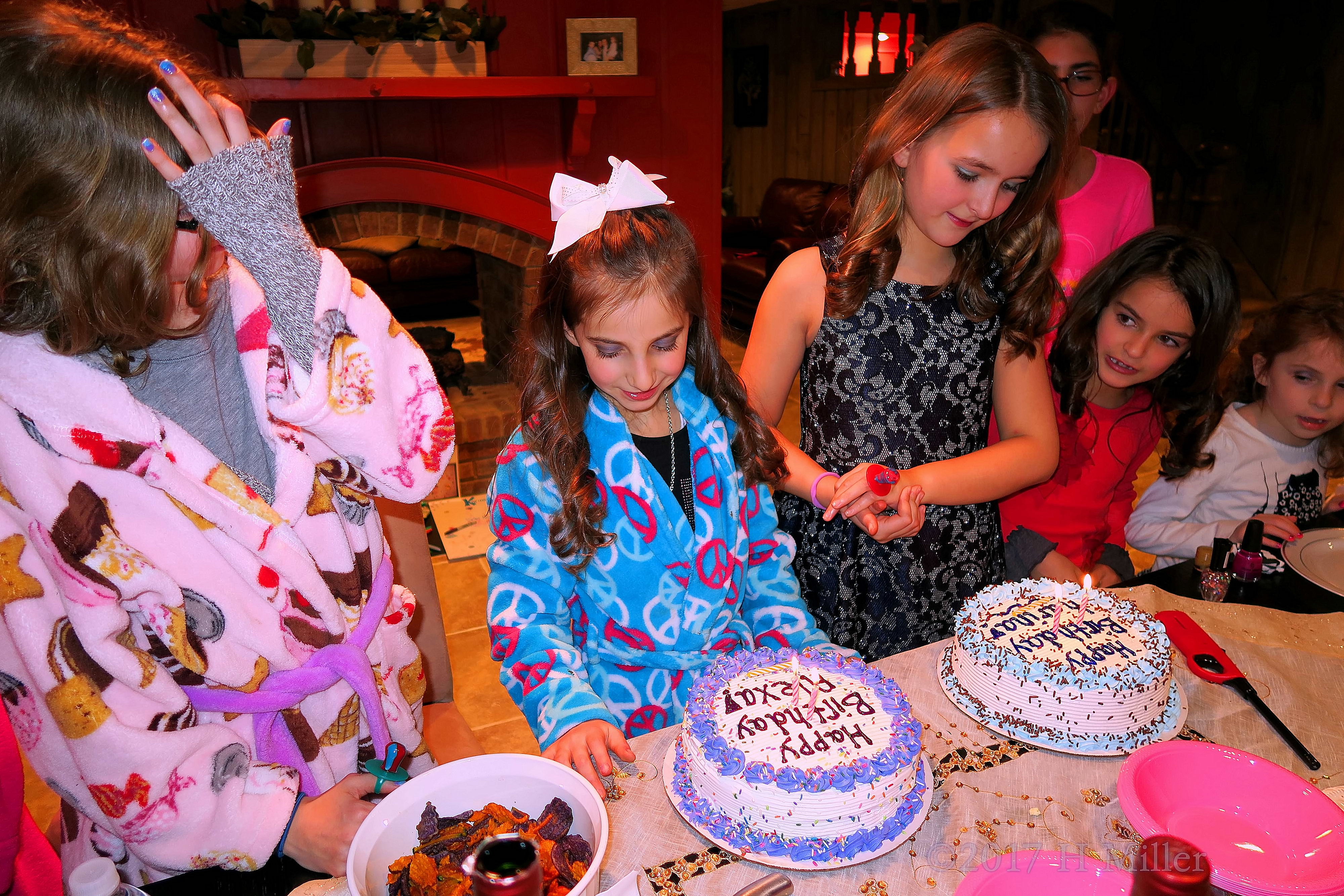 Alexa And Karina Waiting To Blow Out Their Candles At The Kids Spa. 