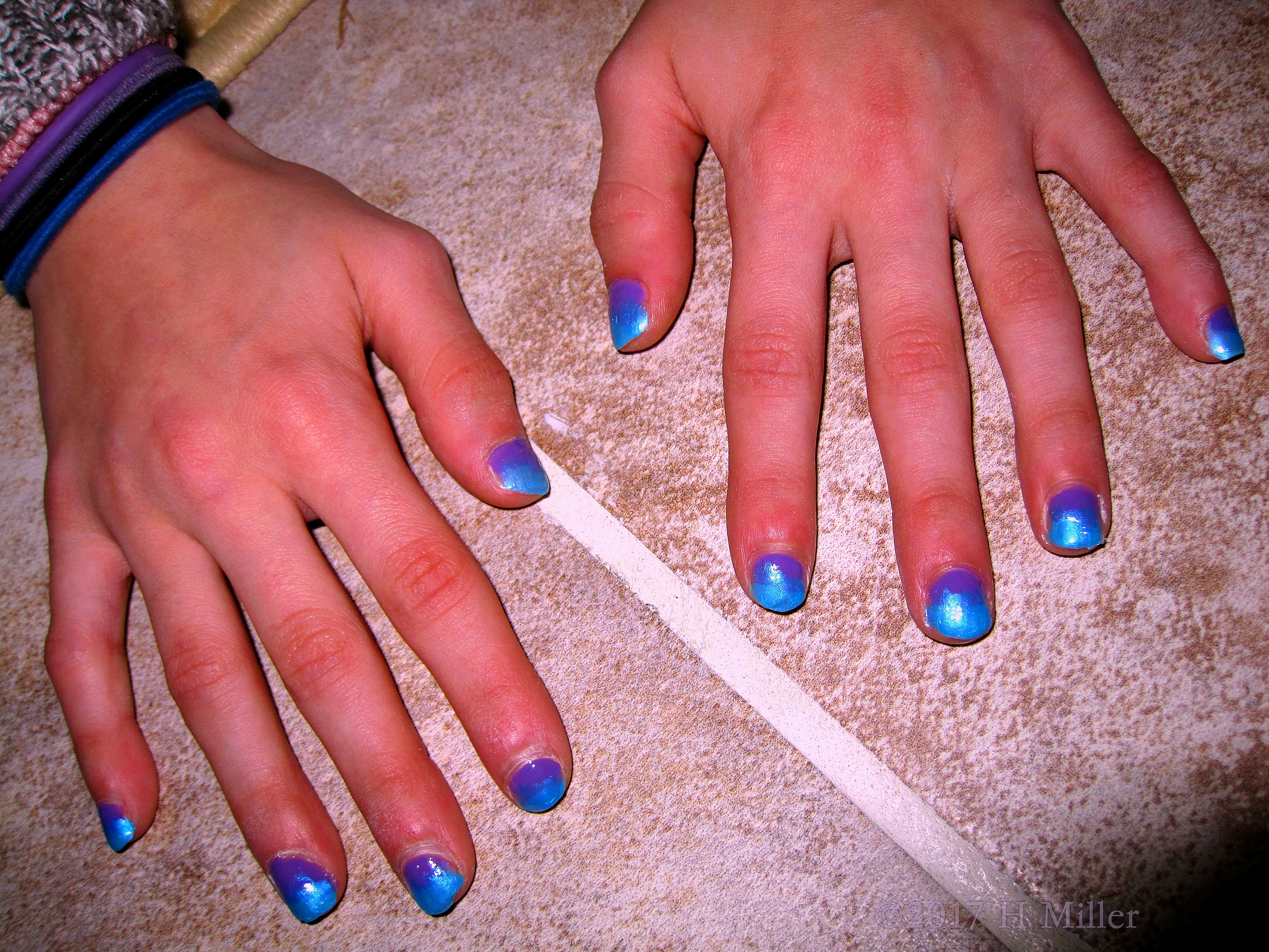 Closeup Of A Very Pretty Blue And Purple Mini Manicure.