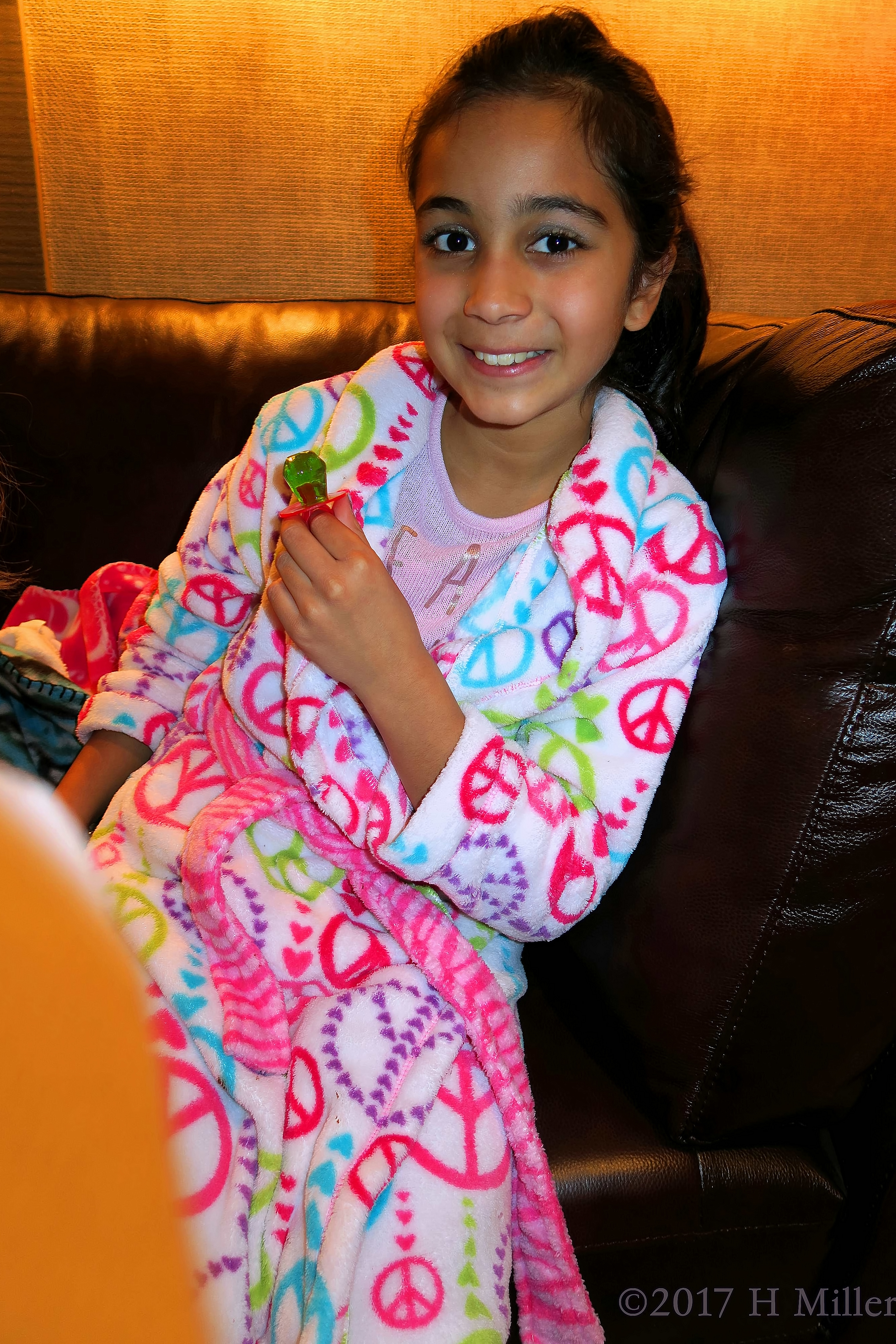 She Is Having Lots Of Fun At The Kids Party, With A Green Ring Pop. She Is Having Lots Of Fun At The Kids Party, With A Green Ring Pop.