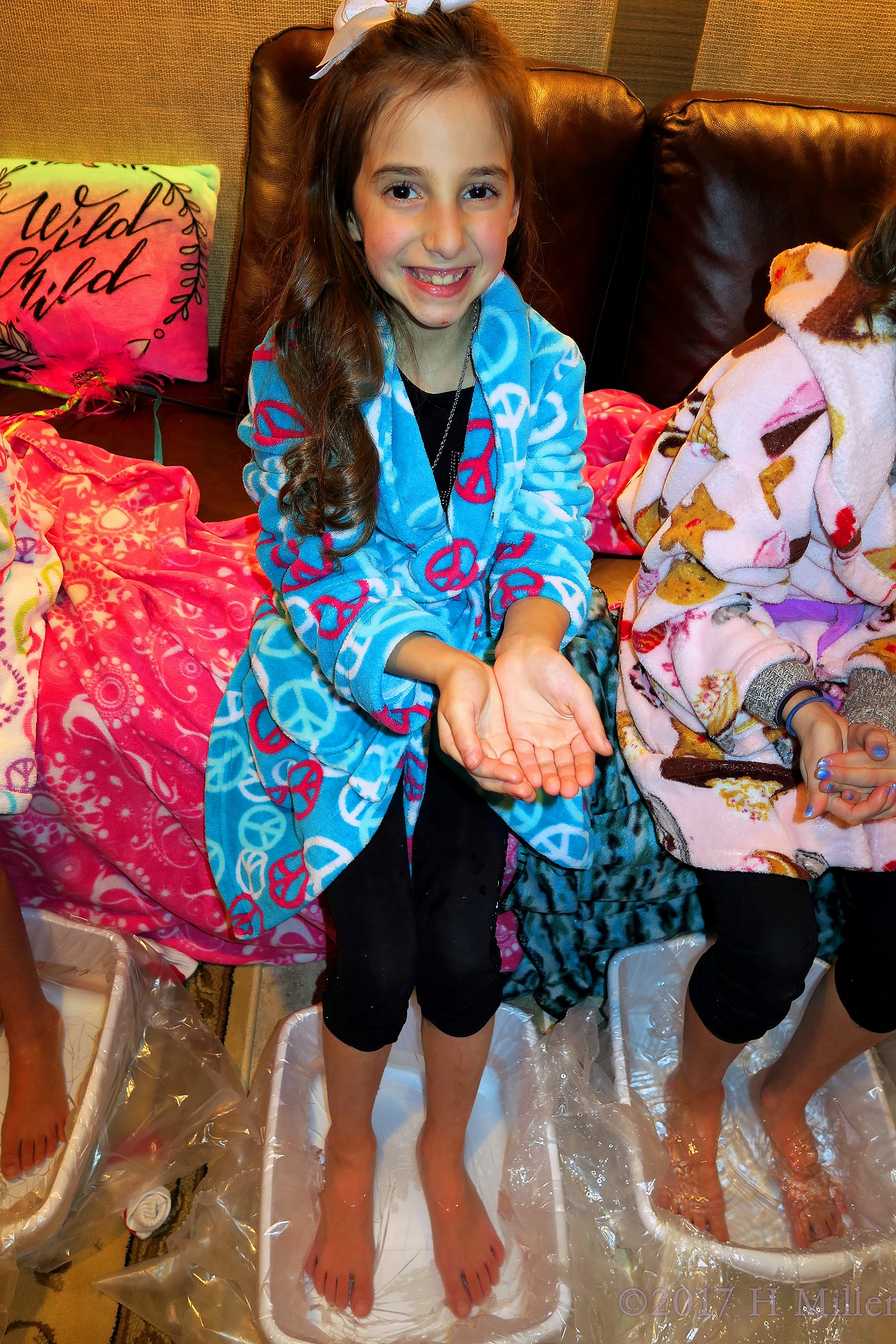 Smiling And Holding The Salt Before Placing It In The Footbath For Pedicures. Smiling And Holding The Salt Before Placing It In The Footbath For Pedicures.