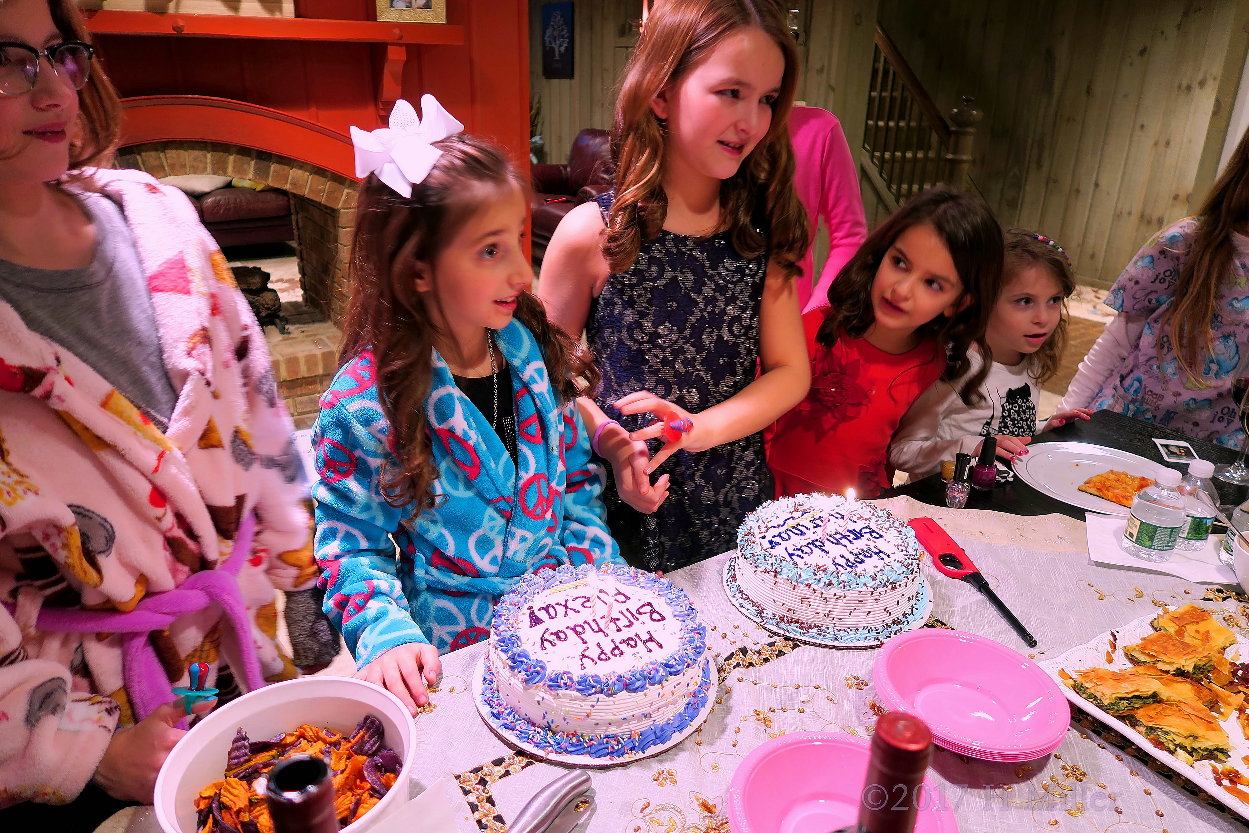 The Two Birthday Girls As Their Friends Sing Happy Birthday. The Two Birthday Girls As Their Friends Sing Happy Birthday.