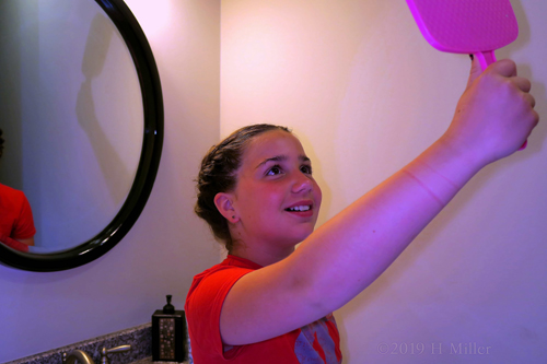 She Looks At Her Cool Girls Hairstyle In The Mirror She Looks At Her Cool Girls Hairstyle In The Mirror