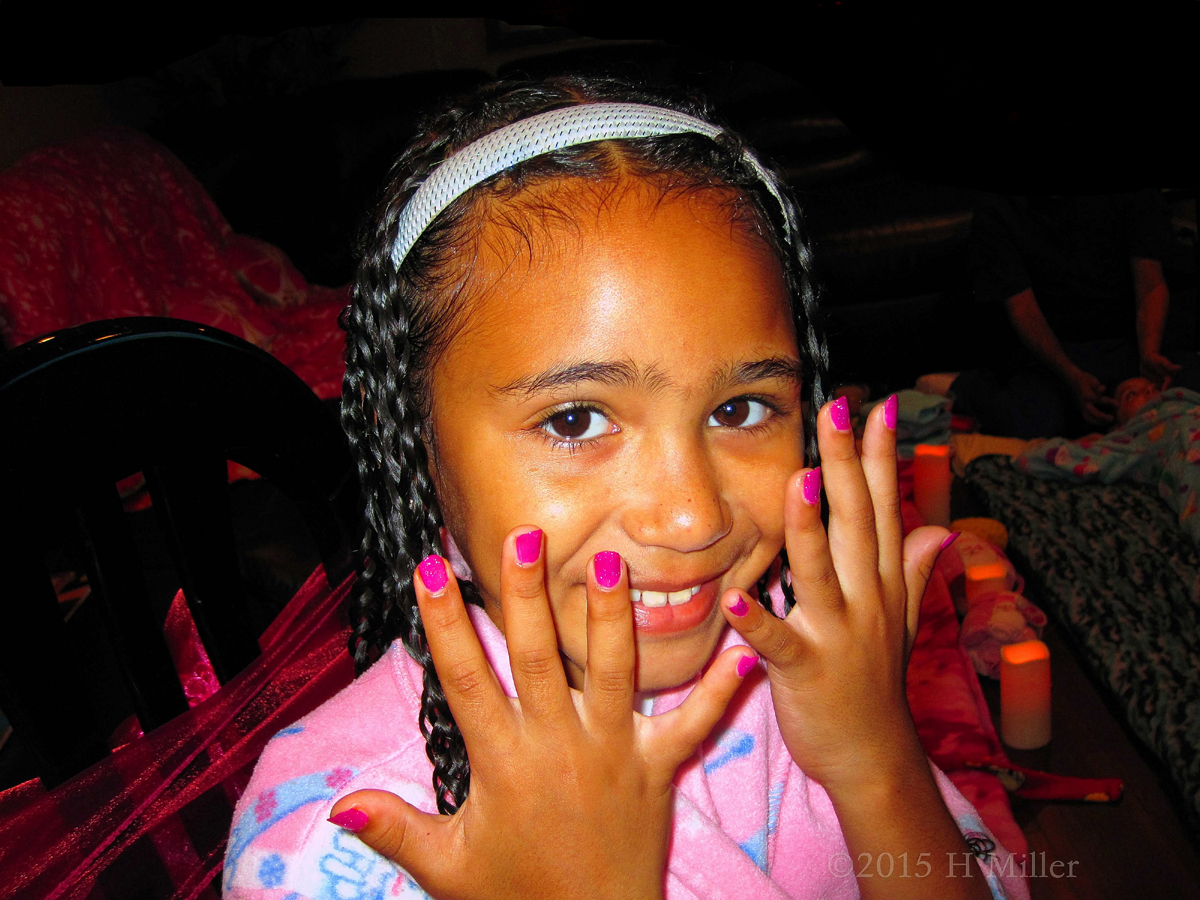 Smiling And Holding Up Her New Hot Pink Kids Mani. 