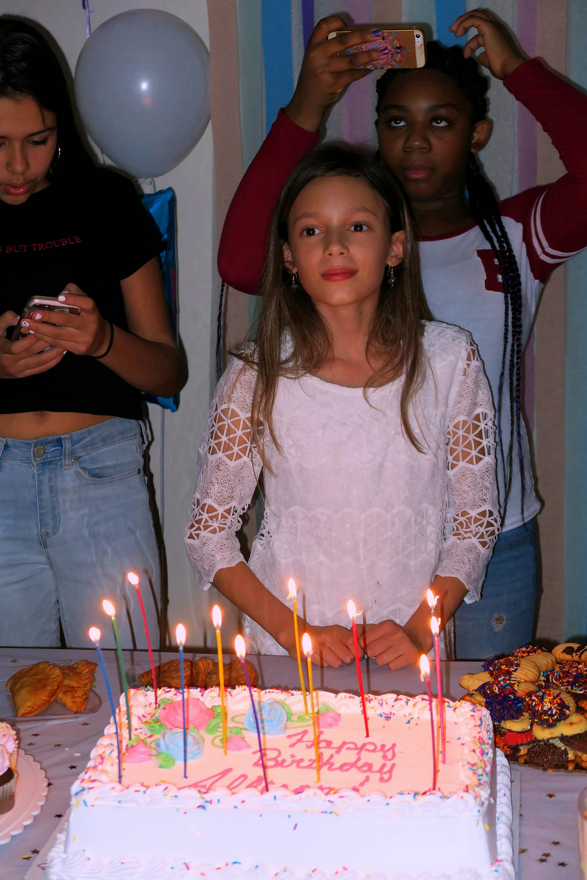 The Birthday Girl Smiles While Waiting For Cake. 