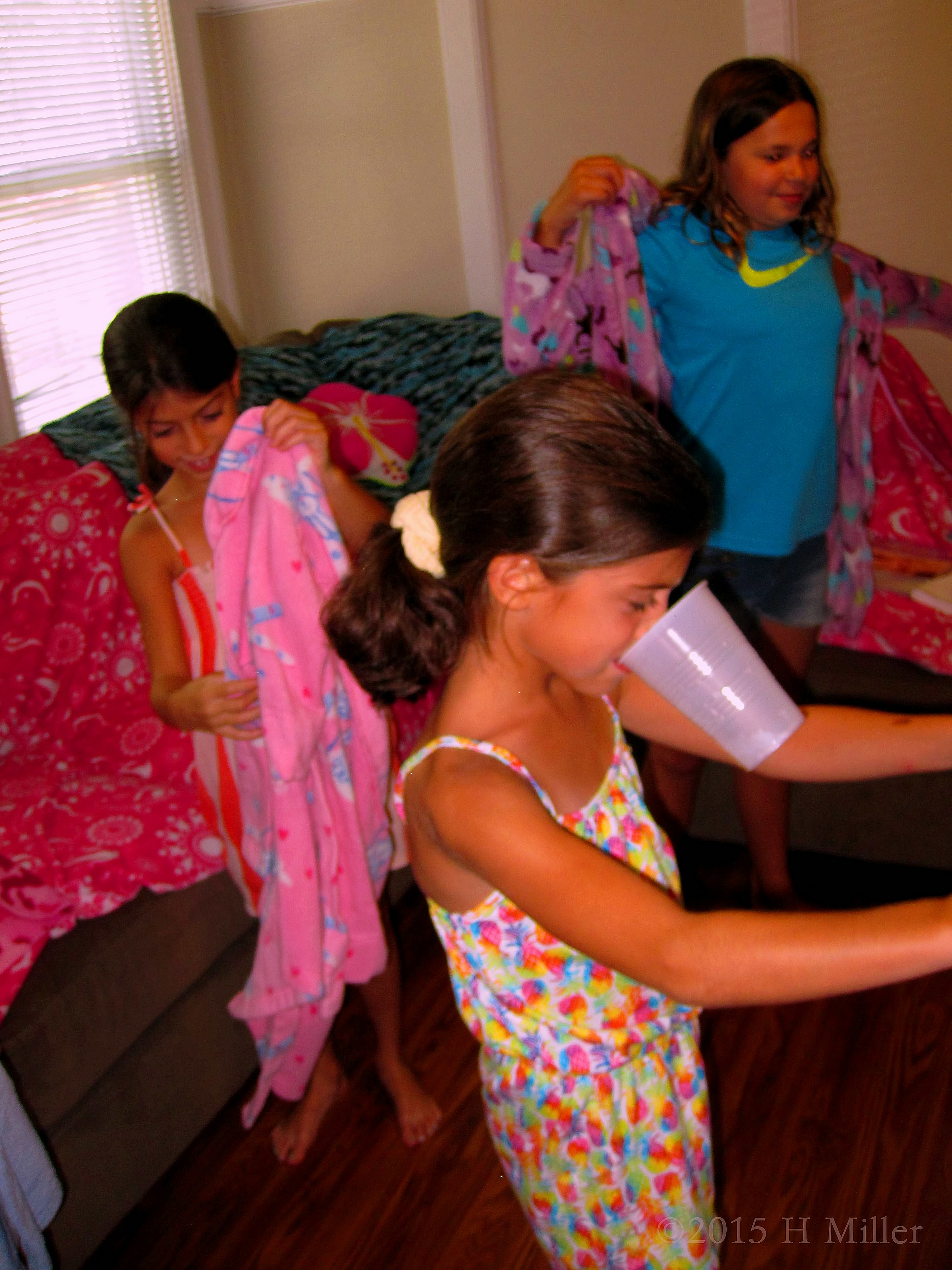 The Girls Putting On The Spa Party Robes. The Girls Putting On The Spa Party Robes.