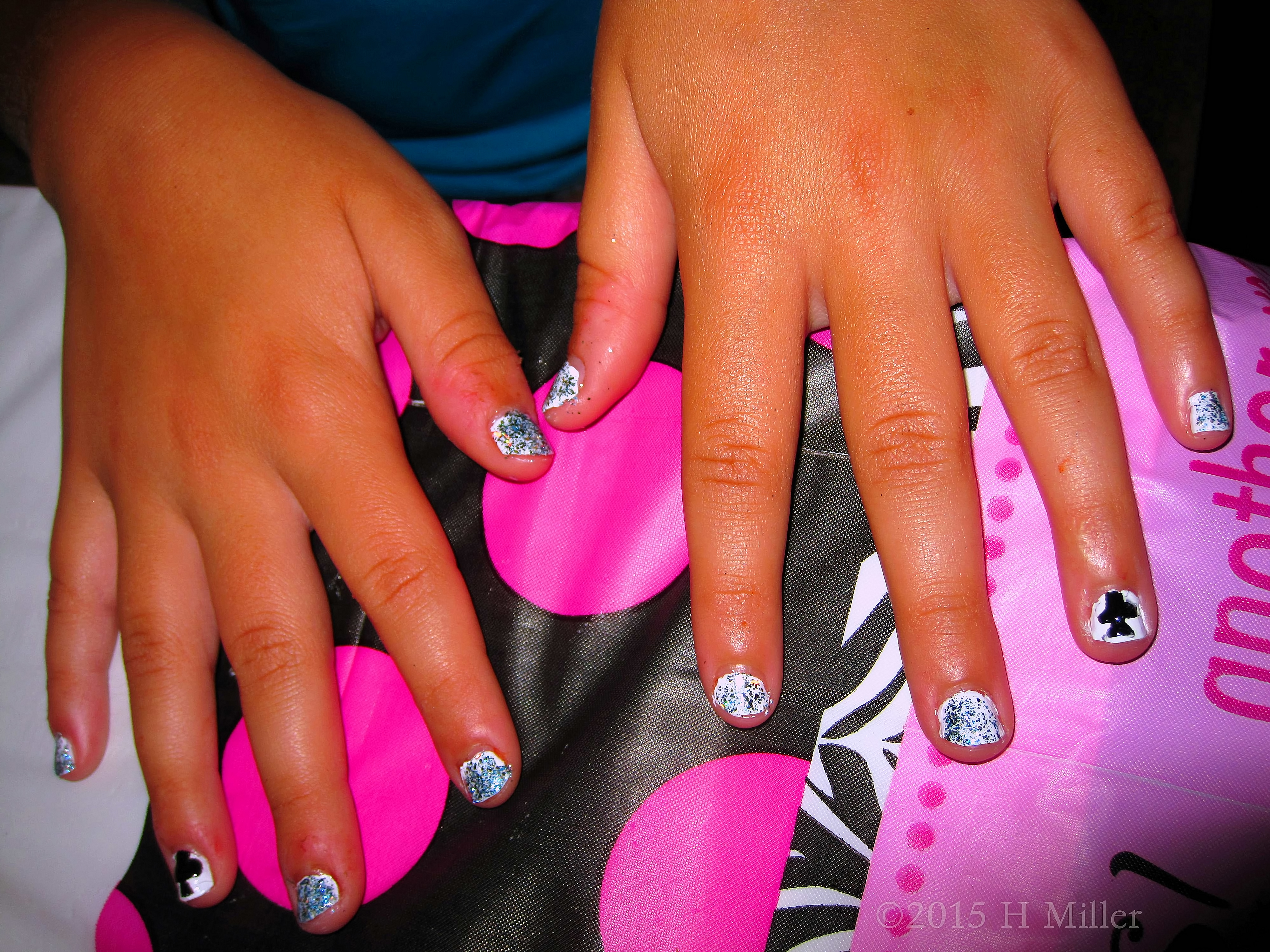 White Polish With Silver Glitter And Spade Nail Art. White Polish With Silver Glitter And Spade Nail Art.