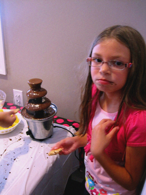 The Birthday Girl Eating Cookies Dipped In The Chocolate Fountain