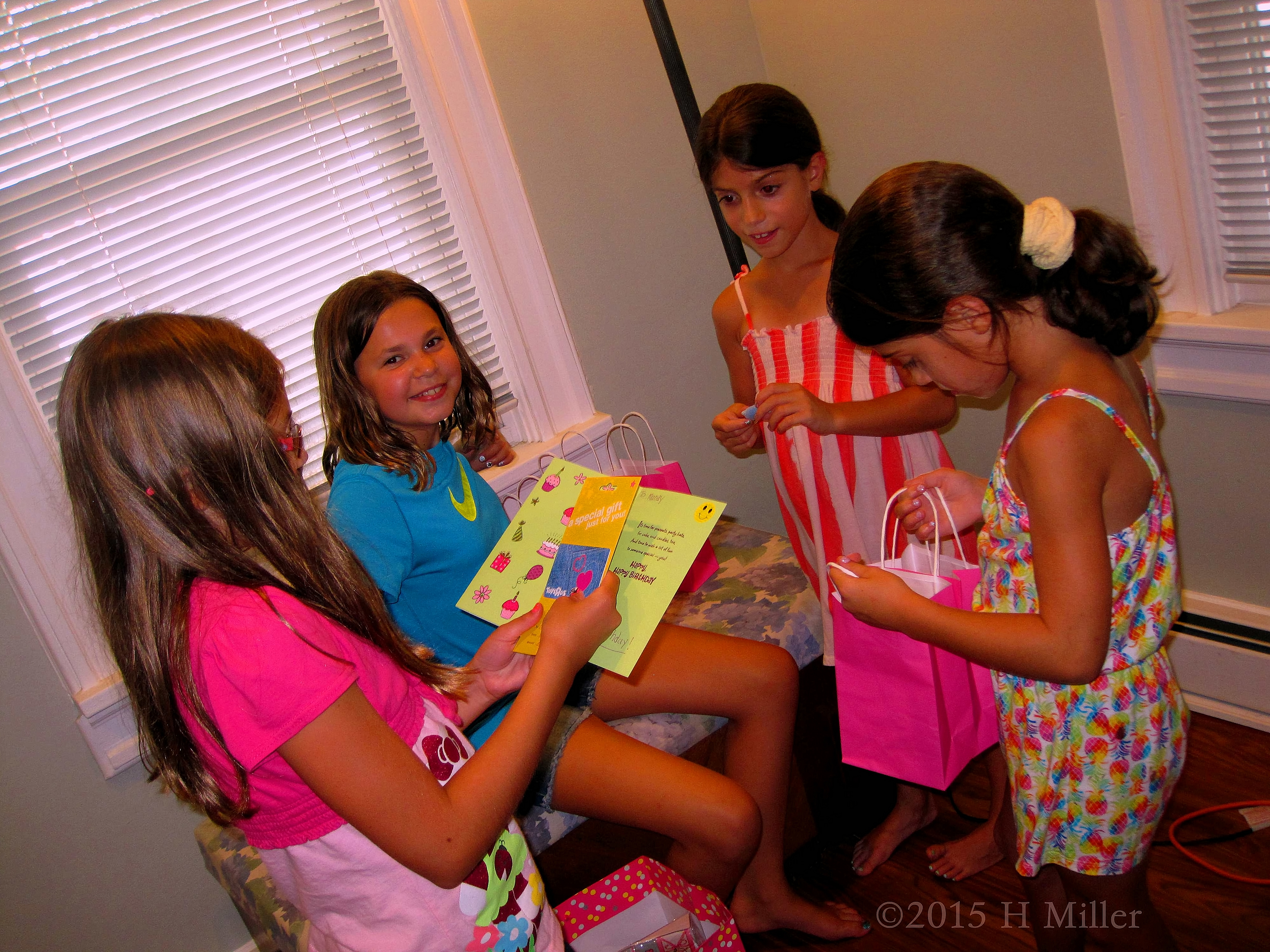 The Birthday Girl Reading A Card From A Friend. The Birthday Girl Reading A Card From A Friend.