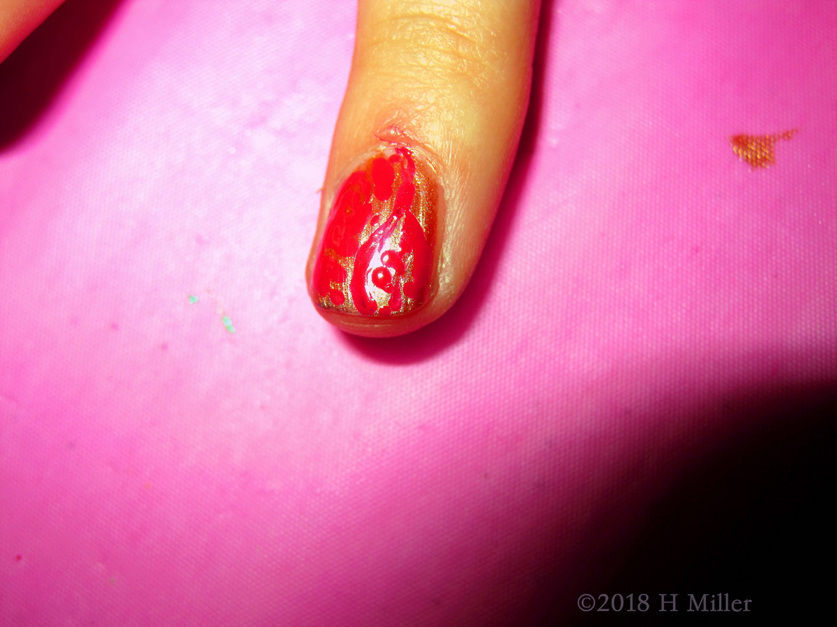 Flakes Of Golden Glitter Amidst The Blood Red Base, Just Perfect Girls Manicure! 