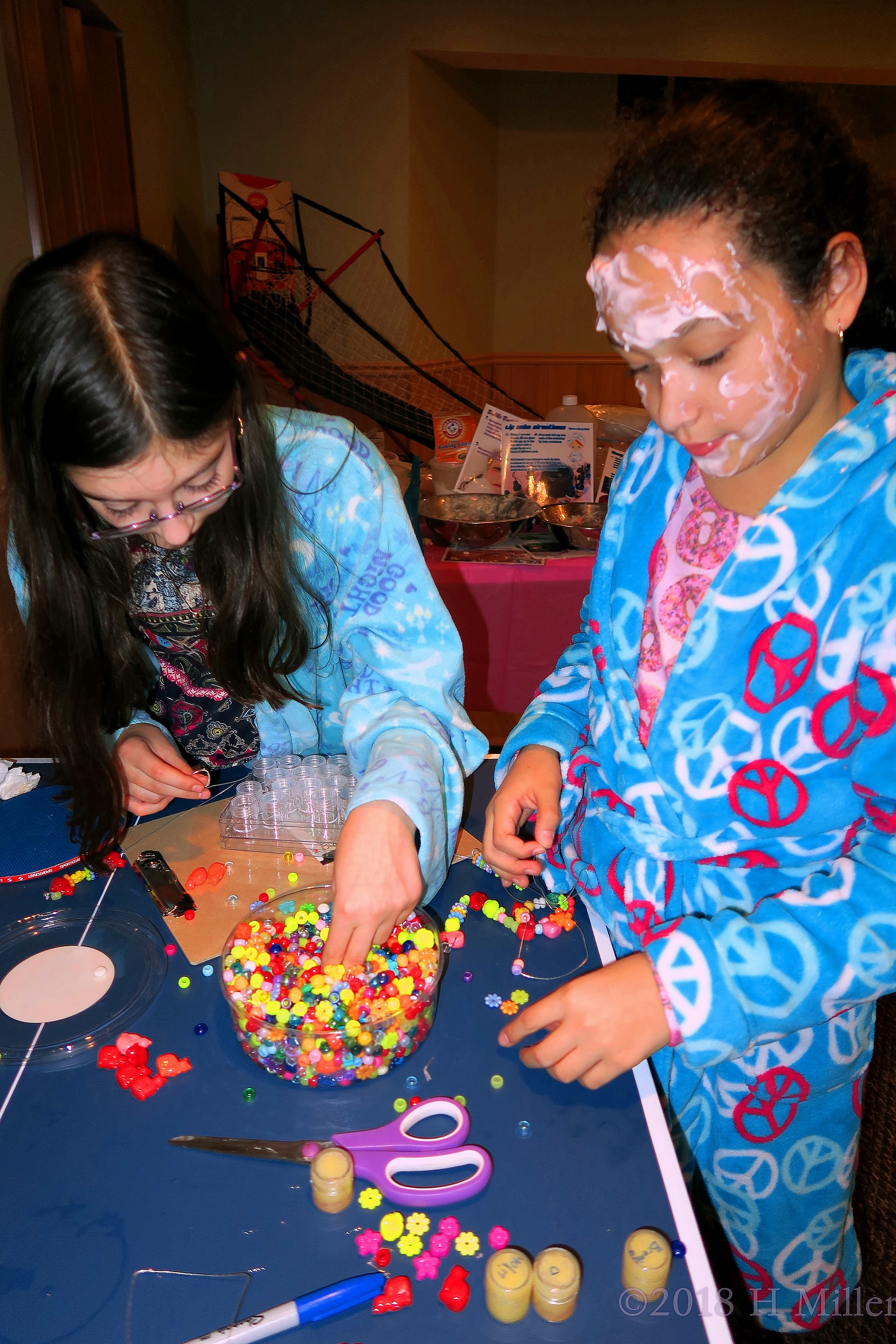 The Girls Are Putting Beads On A String To Make Some Cool Necklaces And Bracelets. The Girls Are Putting Beads On A String To Make Some Cool Necklaces And Bracelets.