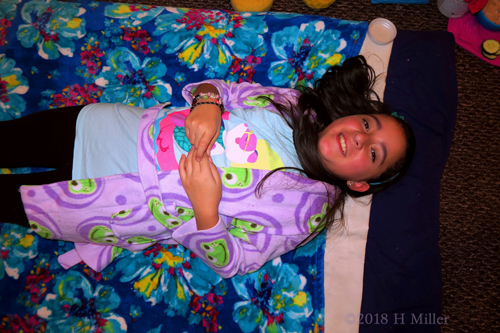 Happily Lying On The Facial Mat For Her Kids Facial Activity!