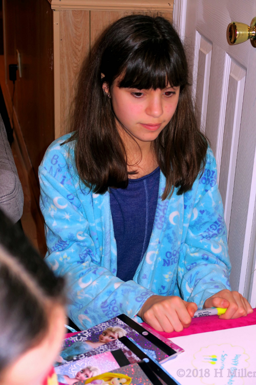 She Has Chosen The Marker To Write A Wish For Amanda On The Spa Birthday Card. She Has Chosen The Marker To Write A Wish For Amanda On The Spa Birthday Card.