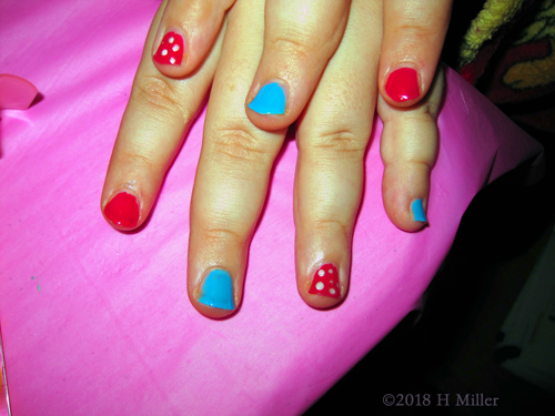 Showing Her Neatly Done Colorful Kids Nail Art!