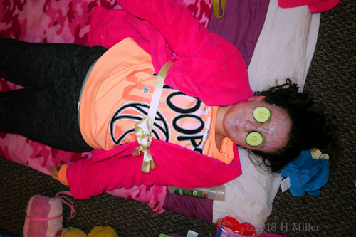 With Facial Mask On And Cukes Over Eyes, She Relaxes!