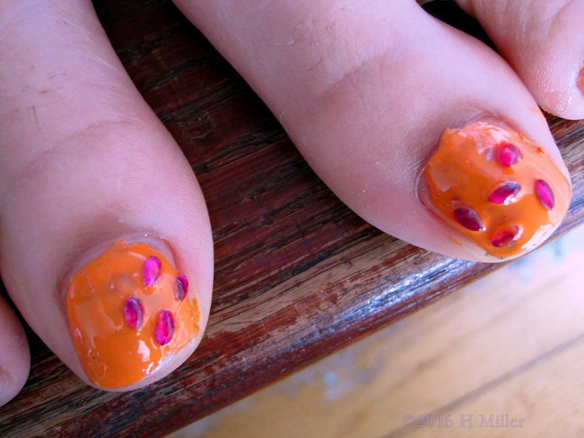 Adorable Pink Jewels On Her Nails For The Kids Manicure. 