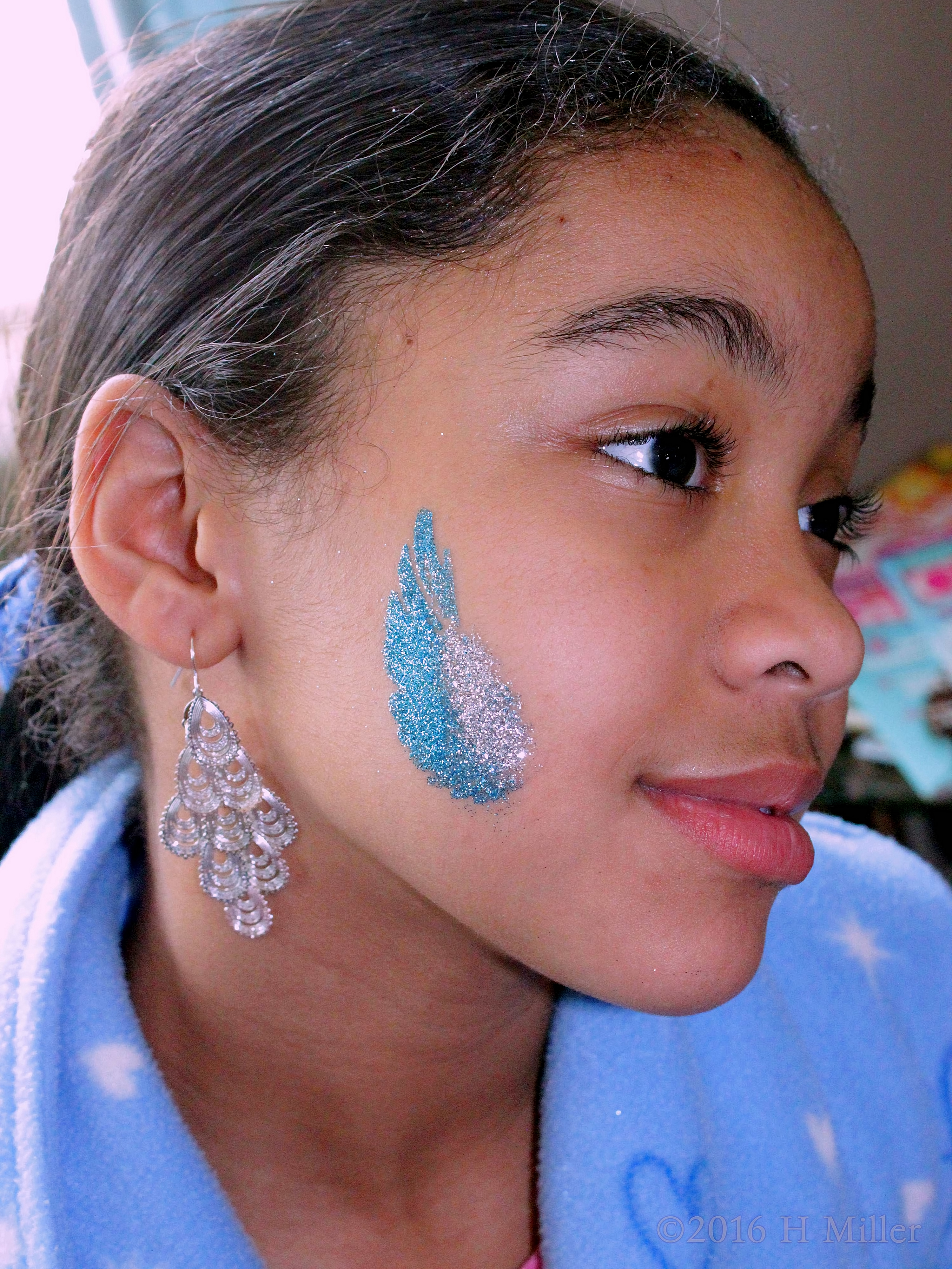 Awesome Blue And Silver Face Glitter Temporary Tattoo. Awesome Blue And Silver Face Glitter Temporary Tattoo.