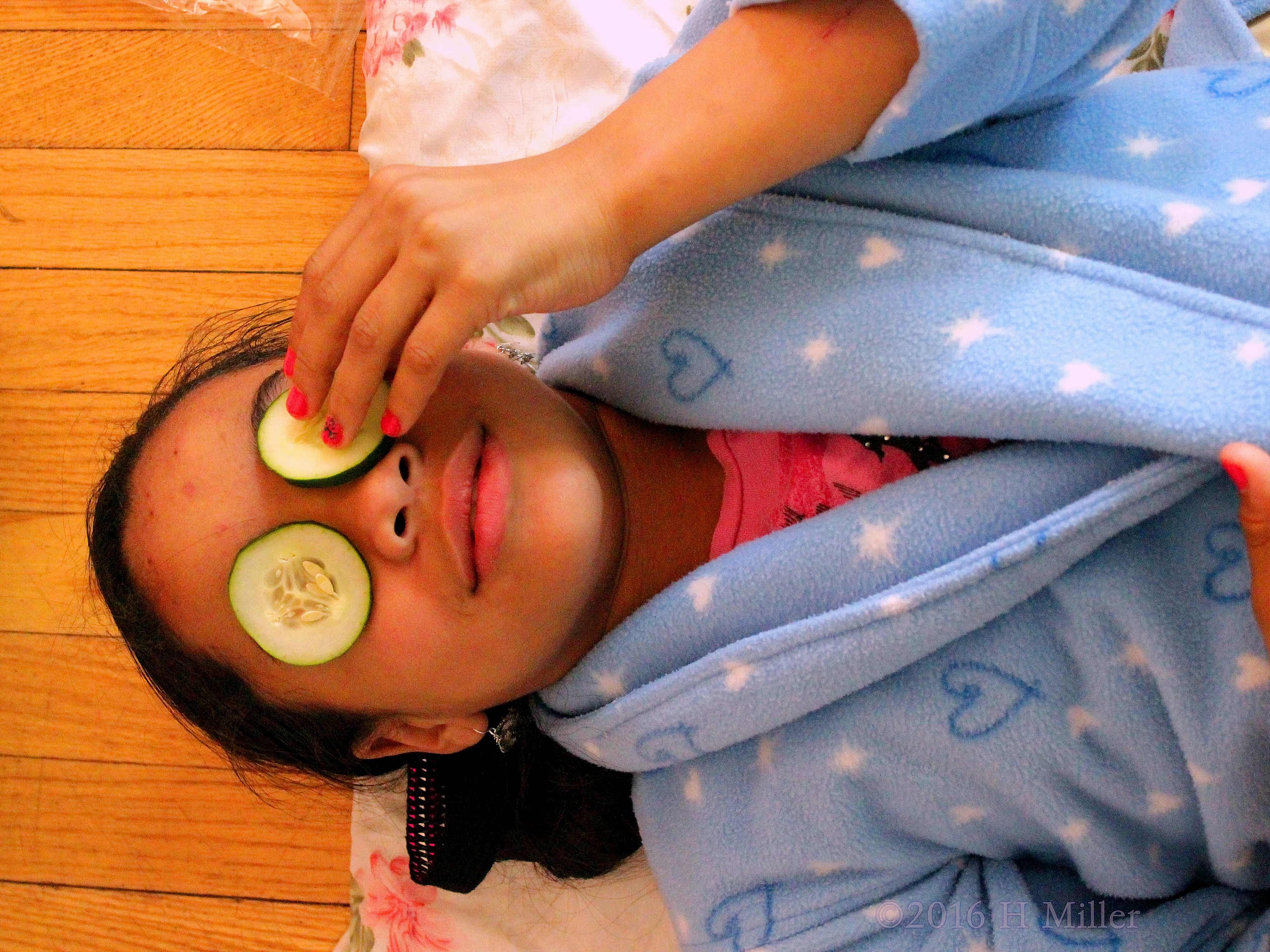 Putting On Cucumbers Before Home Kids Spa Facials 