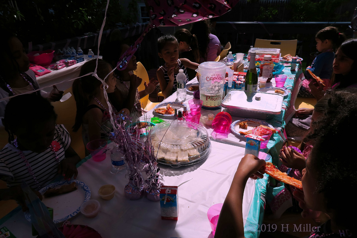 Party Guests Enjoying Food And Beverages At Amiya's Spa Party 