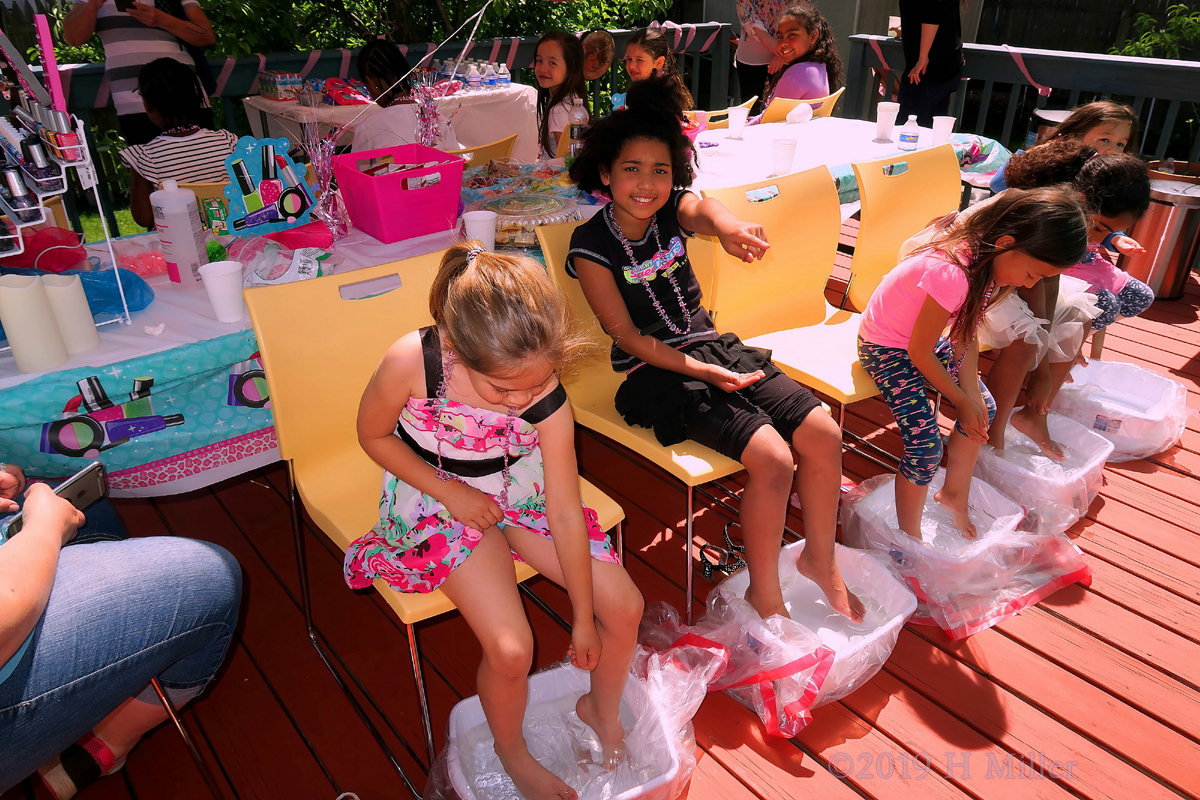 Party Guests Having Fun At The Gorgeously Decorated Venue During Pedicures For Girls 